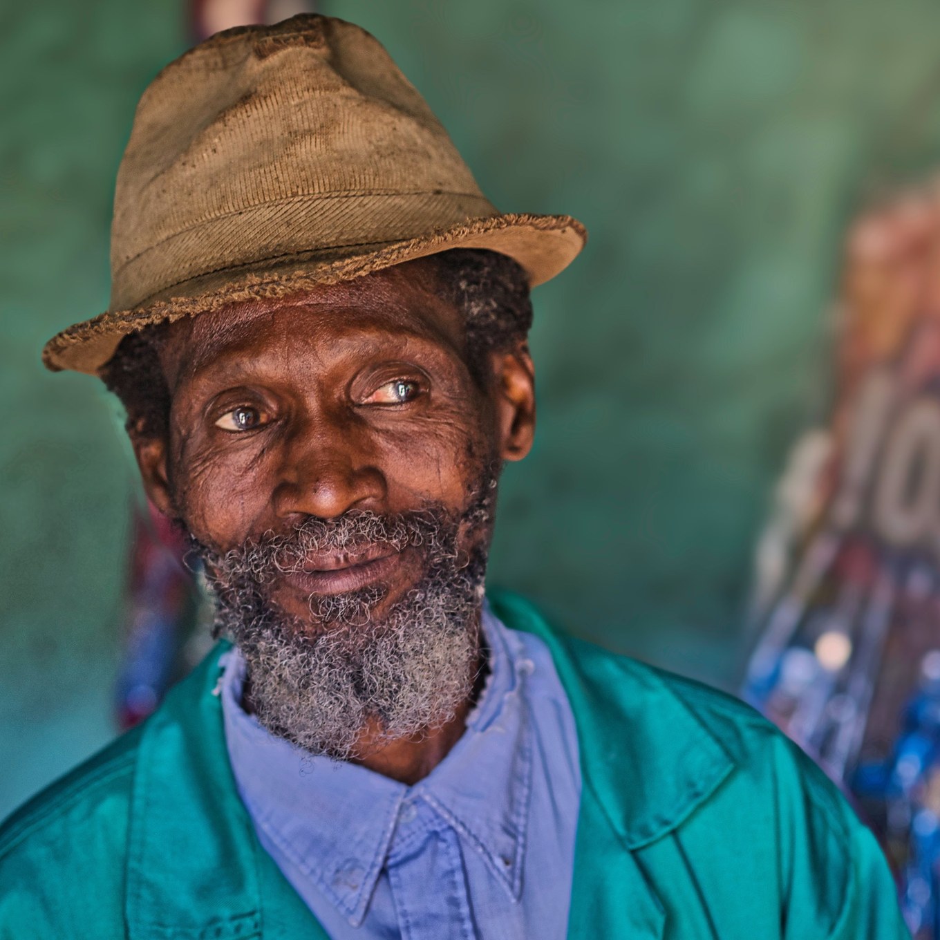 Close portrait of a village elder, eyes holding stories of joy and strife, calm and clear.
